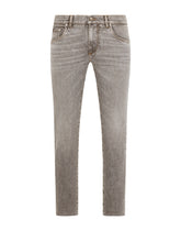 Light blue skinny stretch jeans with frayed turn-ups -  | Dolce & Gabbana