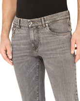 Light blue skinny stretch jeans with frayed turn-ups -  | Dolce & Gabbana