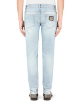 Light blue skinny stretch jeans with rips -  | Dolce & Gabbana
