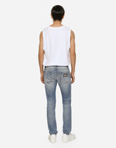 Light blue skinny stretch jeans with rips -  | Dolce &amp; Gabbana