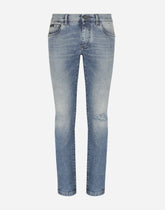 Light blue skinny stretch jeans with rips -  | Dolce &amp; Gabbana