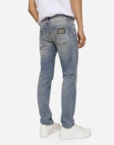 Light blue skinny stretch jeans with rips -  | Dolce &amp; Gabbana