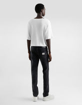 Skinny jeans in stretch cotton with plaque -  | Dolce &amp; Gabbana