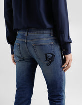 Skinny jeans in stretch cotton with logo embroidery -  | Dolce &amp; Gabbana