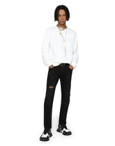 Black skinny stretch jeans with repaired rips -  | Dolce & Gabbana