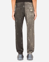 Two-tone regular-fit jeans with pearl pendants and DG logo -  | Dolce &amp; Gabbana