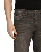 WASHED STRETCH DENIM LOOSE JEANS -  | Dolce & Gabbana