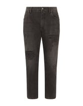 Loose black wash jeans with rips and DG patch -  | Dolce &amp; Gabbana