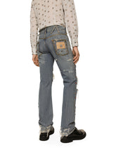 Washed denim jeans with studs and rips -  | Dolce &amp; Gabbana