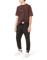 Wool jogging pants with camouflage-print details -  | Dolce & Gabbana