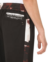 Wool jogging pants with camouflage-print details -  | Dolce & Gabbana