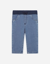 Blue stretch denim pants with a logo plaque -  | Dolce &amp; Gabbana