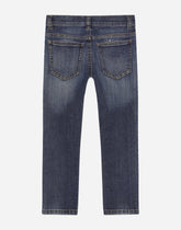 Slim-fit blue wash jeans with heraldic patch -  | Dolce &amp; Gabbana