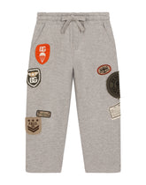 Jogging pants with decorative patches -  | Dolce & Gabbana