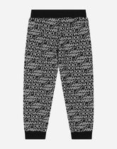 Cotton jogging pants with the all-over logo print -  | Dolce &amp; Gabbana