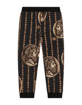 Cotton jogging pants with all-over coin print -  | Dolce & Gabbana