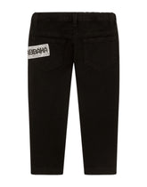 Slim-fit jeans with fusible rhinestone appliqués -  | Dolce & Gabbana