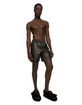 Mid-length swim trunks with branded band -  | Dolce & Gabbana