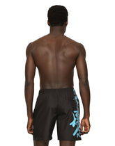 Mid-length swim trunks with spray-paint DG print -  | Dolce & Gabbana