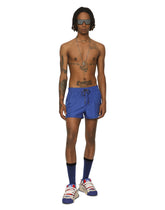 Short swim trunks with embossed DG logo -  | Dolce & Gabbana