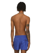 Short swim trunks with embossed DG logo -  | Dolce & Gabbana