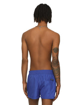 Short swim trunks with embossed DG logo -  | Dolce & Gabbana