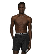 Mid-length swim trunks with branded band -  | Dolce &amp; Gabbana
