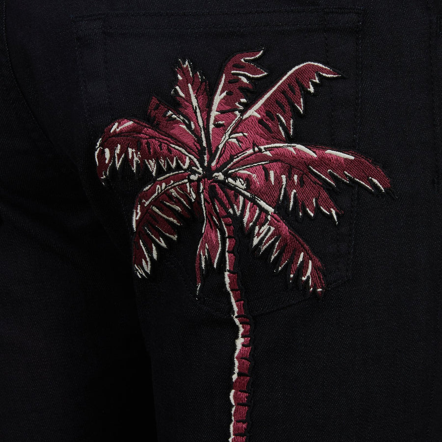 Five-pocket jeans with tropical palm patch